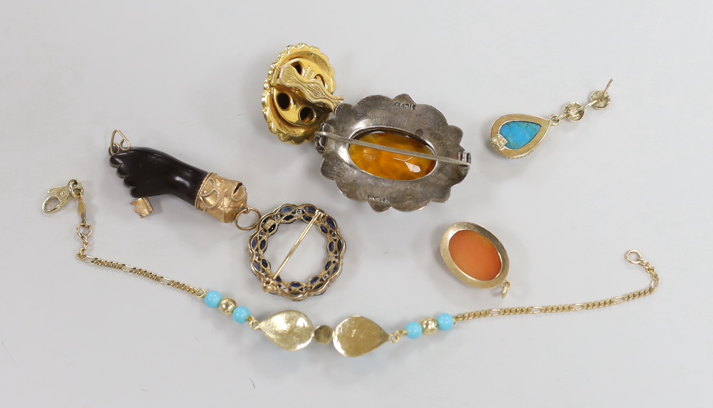 A 585 yellow metal and simulated turquoise set bracelet, A Victorian yellow metal mounted clasped hand with key charm and five other items including Scottish hardstone brooch and a 375 and gem set brooch.